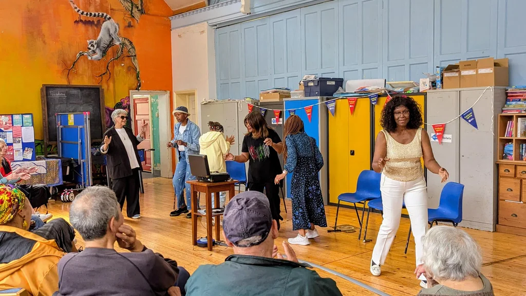 A group of older women perform a theatre show