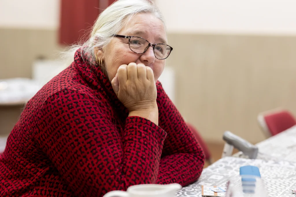 A woman thinking at a table